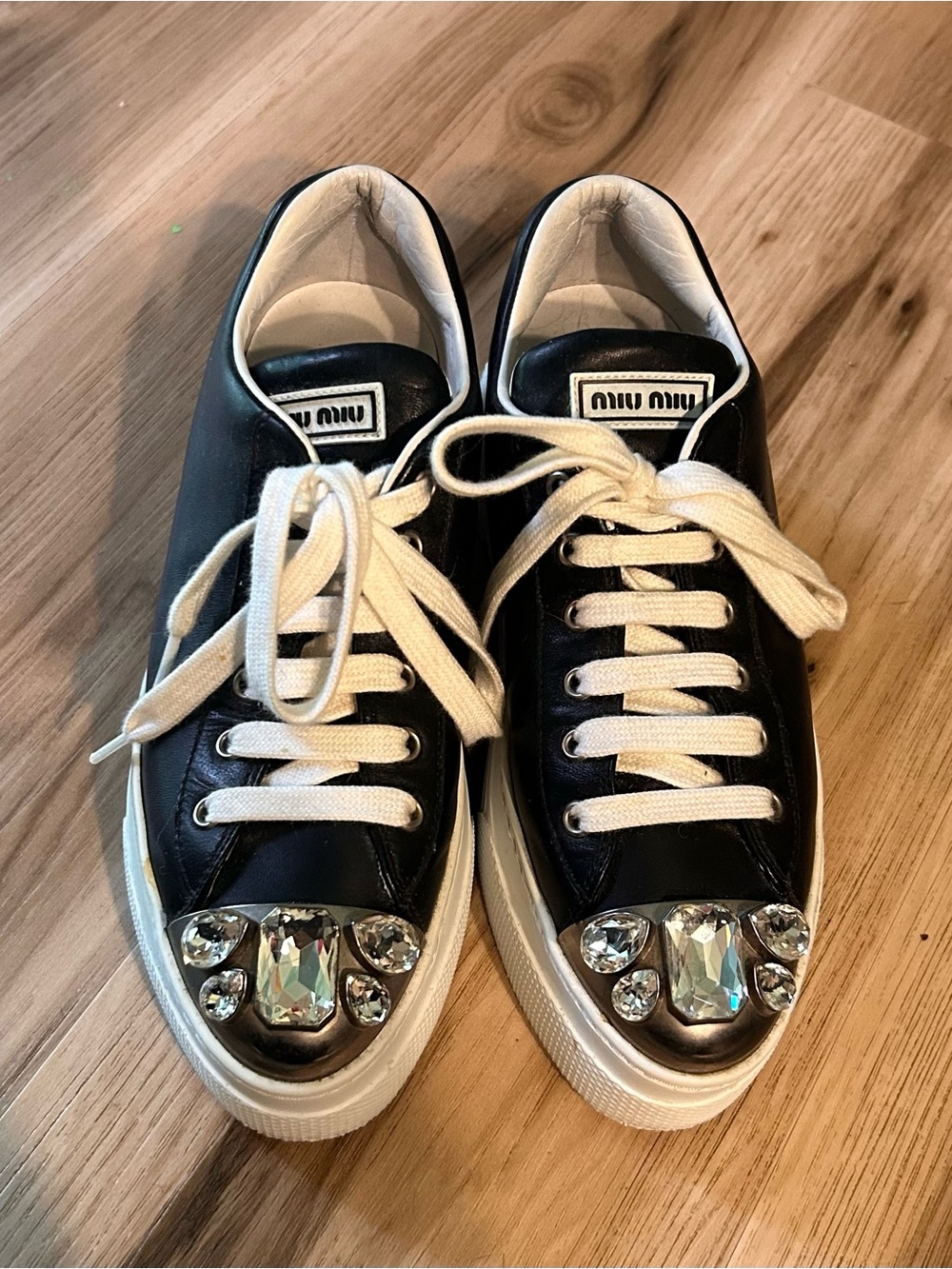 Miu Miu Black Leather Sneakers with White Laces and Crystal Toe Embellishments